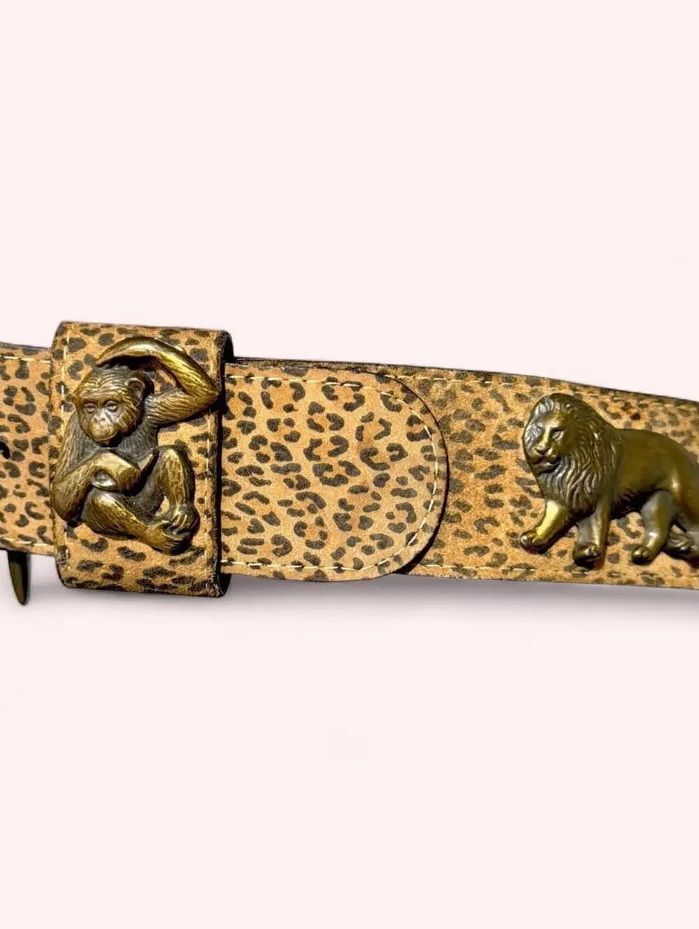 Leopard print western belt with animal accents throughout and chunky buckle!